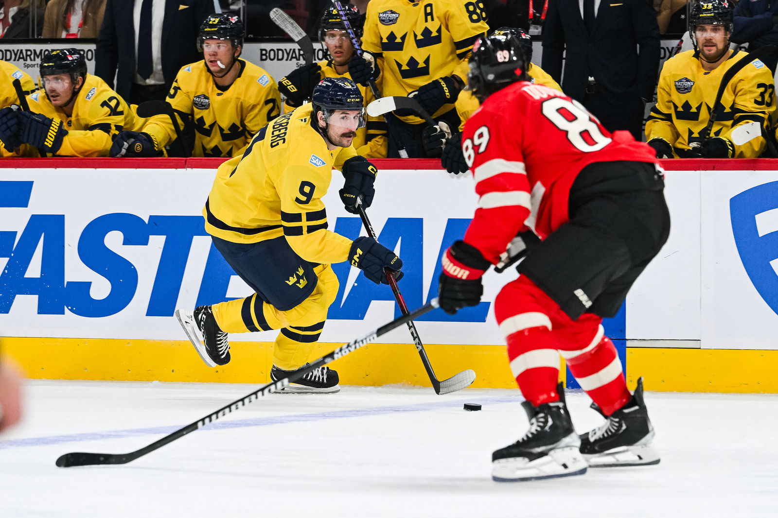 Feb. 12, 2025; Montreal, Quebec, CAN; [Imagn Images direct customers only] Team Sweden forward Filip Forsberg (9) plays the puck against Team Canada defenseman Drew Doughty (89) in the second period during a 4 Nations Face-Off ice hockey game at Bell Centre. Mandatory Credit: David Kirouac-Imagn Images