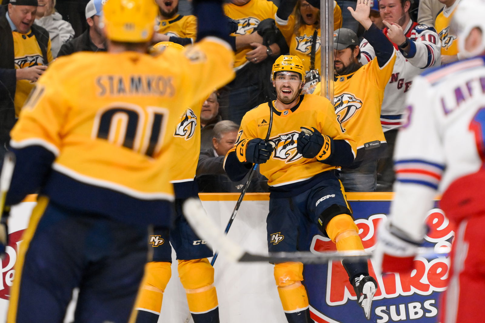 Dec 17, 2024; Nashville, Tennessee, USA; Nashville Predators defenseman Adam Wilsby (83) celebrates his goal against the New York Rangers during the third period at Bridgestone Arena. Mandatory Credit: Steve Roberts-Imagn Images