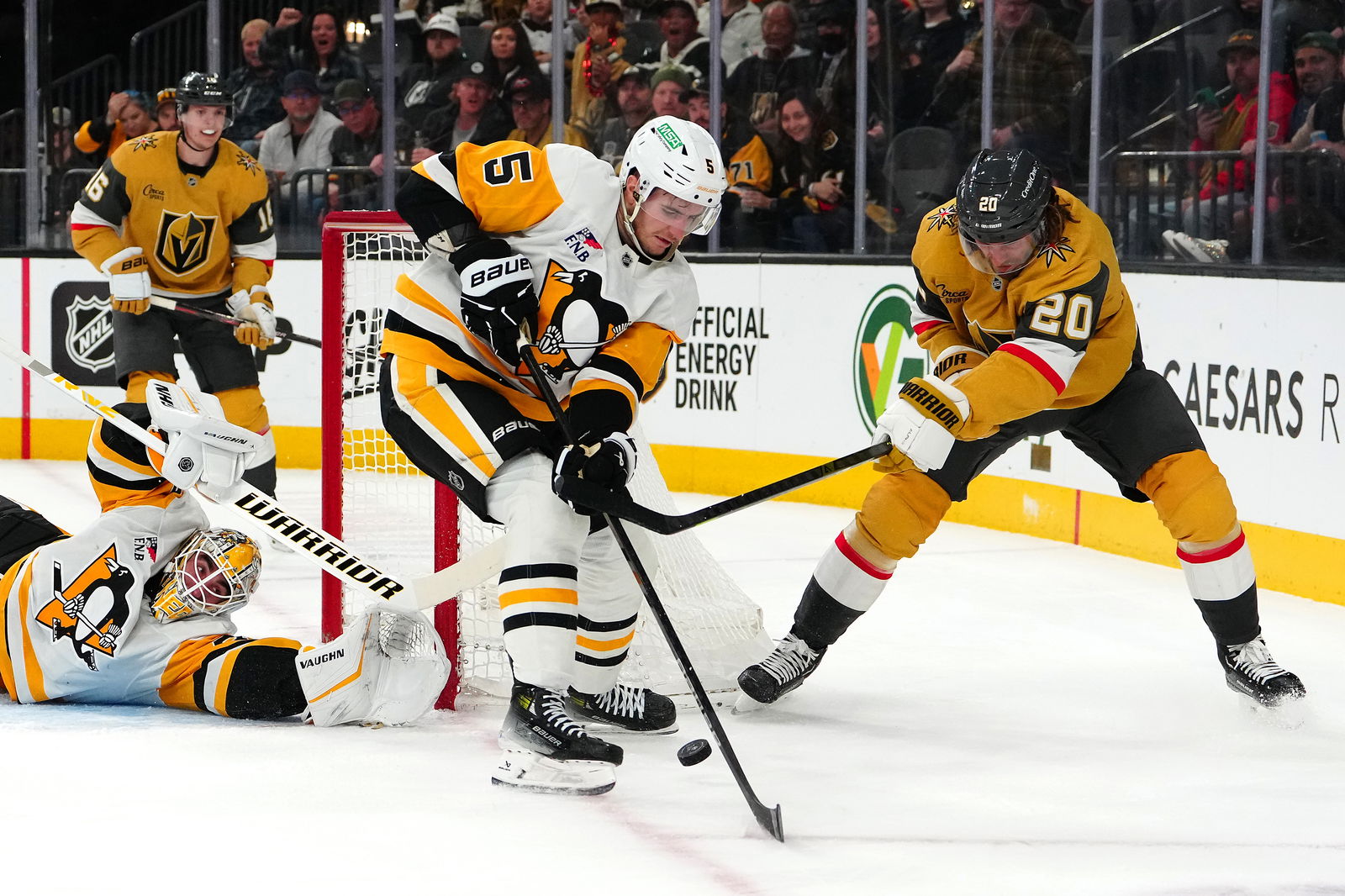 Mar 7, 2025; Las Vegas, Nevada, USA; Pittsburgh Penguins goaltender Alex Nedeljkovic (39) defends his net as Pittsburgh Penguins defenseman Ryan Shea (5) tips the puck away from Vegas Golden Knights left wing Brandon Saad (20) during the second period at T-Mobile Arena. Mandatory Credit: Stephen R. Sylvanie-Imagn Images