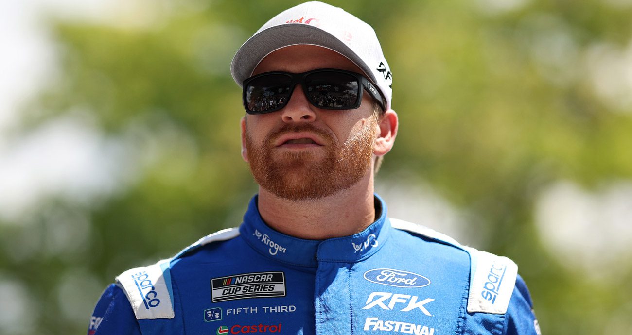 Chris Buescher looks on.