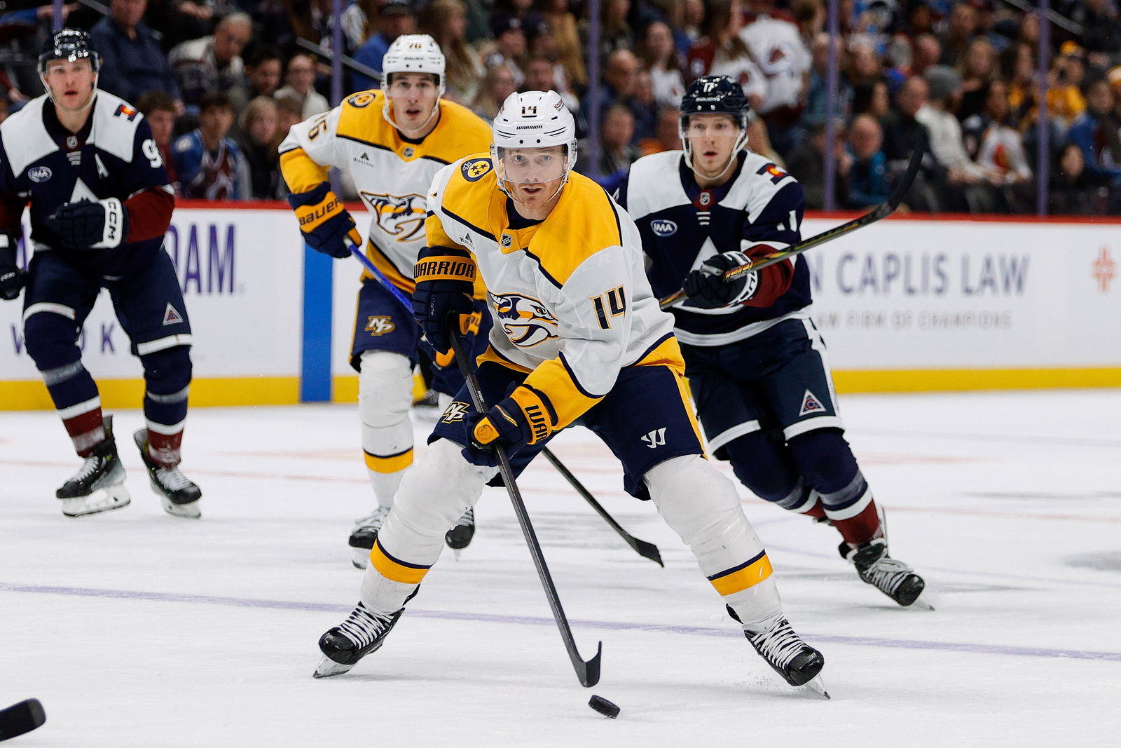 Dec 14, 2024; Denver, Colorado, USA; Nashville Predators center Gustav Nyquist (14) controls the puck in the third period against the Colorado Avalanche at Ball Arena. Mandatory Credit: Isaiah J. Downing-Imagn Images