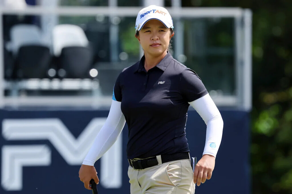 Miranda Wang rides a hot putter on rain-softened course and builds 3-shot lead on LPGA