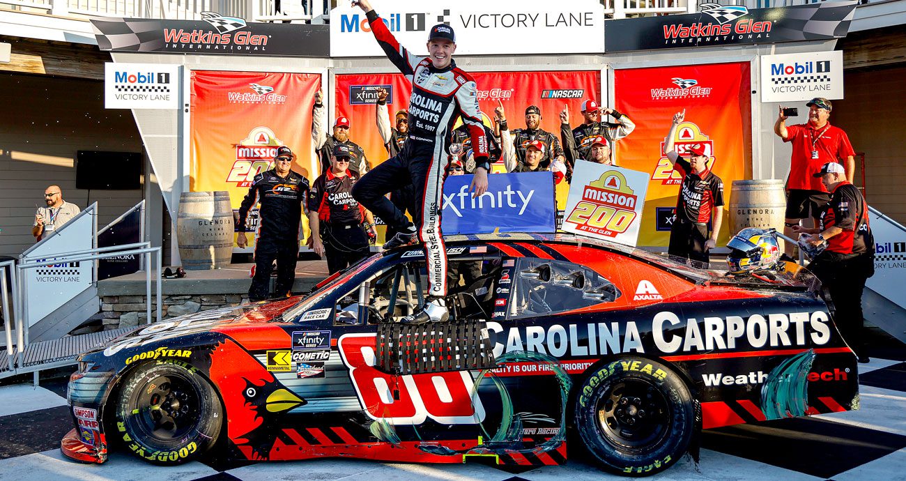 Connor Zilisch stands atop his No. 88 JR Motorsports Chevrolet following his NASCAR Xfinity Series win at Watkins Glen International.