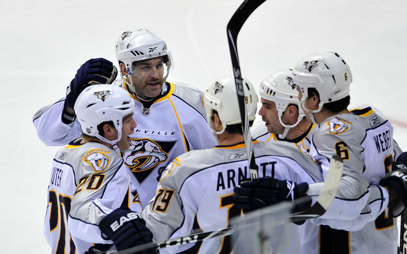 Nov 25, 2009; Denver, CO, USA; Nashville Predators right wing J.P. Dumont (71) (back-center) celebrates a goal with his teammates in the first period against the Colorado Avalanche at the Pepsi Center. Mandatory Credit: Ron Chenoy-Imagn Images