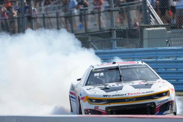 Shane van Gisbergen (88) does donuts on the track after finishing first during a NASCAR Cup Series auto race in Watkins Glen, N.Y., Sunday, Aug. 10, 2025. (AP Photo/Seth Wenig)