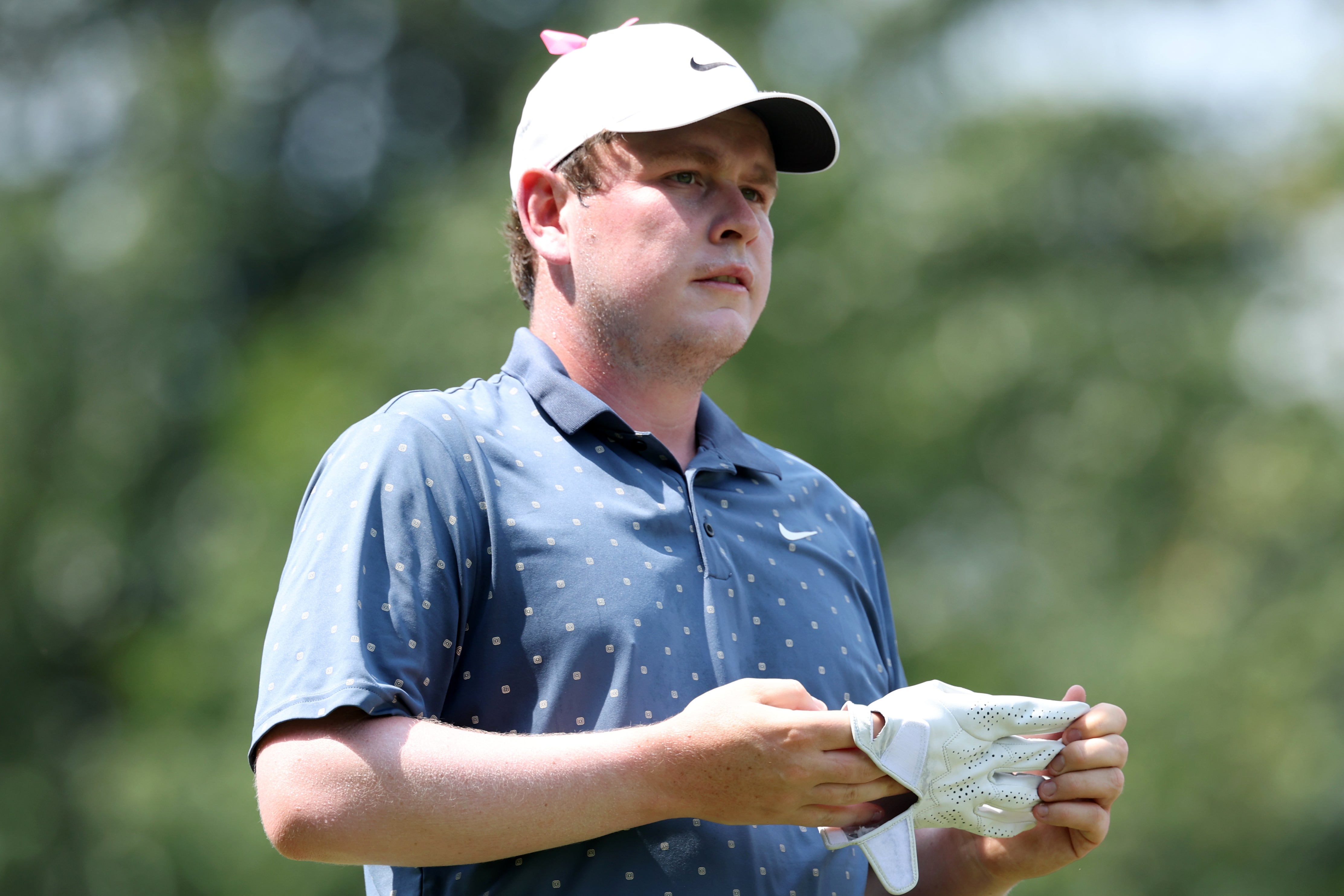 Robert MacIntyre of Scotland prepares to putt on the first green at Caves Valley Golf Club