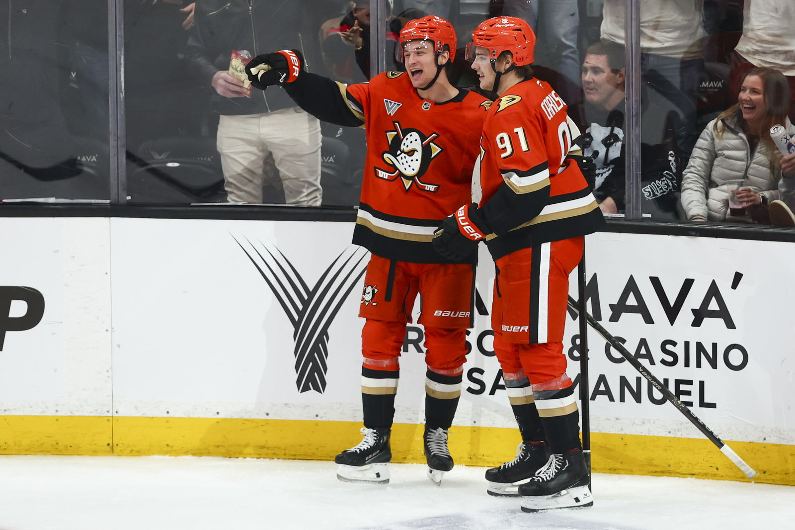 Feb 4, 2025; Anaheim, California, USA; Anaheim Ducks center Trevor Zegras (11) celebrates with center Leo Carlsson (91) after scoring a goal during the third period of a hockey game against the Dallas Stars at Honda Center. Mandatory Credit: Jessica Alcheh-Imagn Images