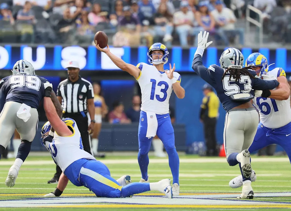 Rams quarterback Stetson Bennett launches a pass to wide receiver Britain Covey during the first quarter Saturday.