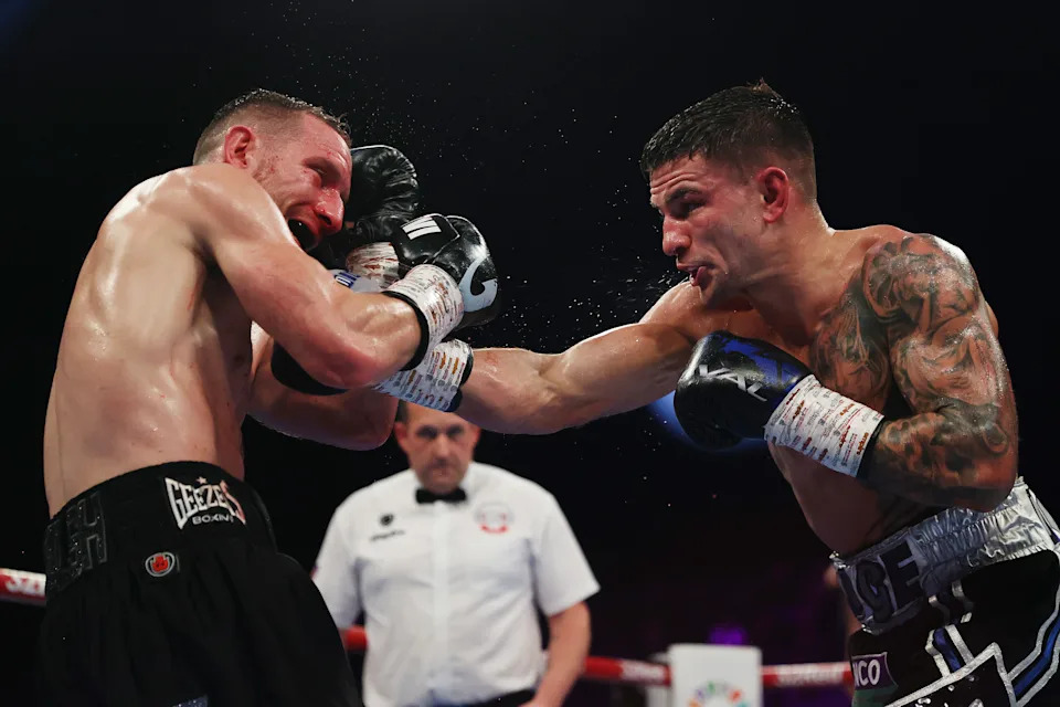 LONDON, ENGLAND - DECEMBER 07: Sam Noakes punches Ryan Walsh during the British, Commonwealth and WBO International Lightweight titles' fight between Sam Noakes and Ryan Walsh at OVO Arena Wembley on December 07, 2024 in London, England. (Photo by James Chance/Getty Images)