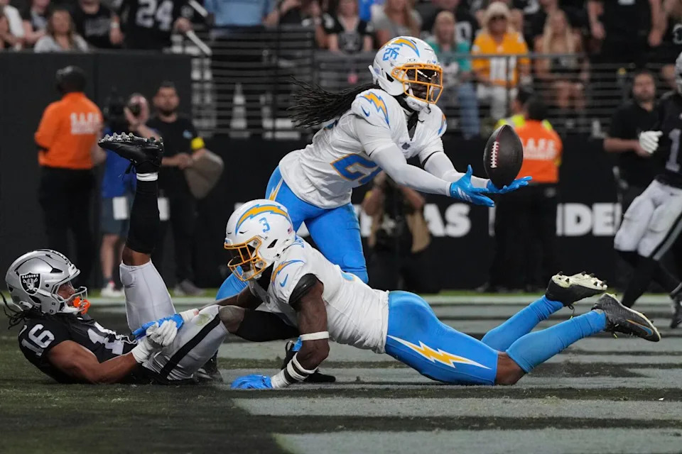 Chargers cornerback Donte Jackson intercepts a pass intended for Raiders wide receiver Jakobi Meyers.