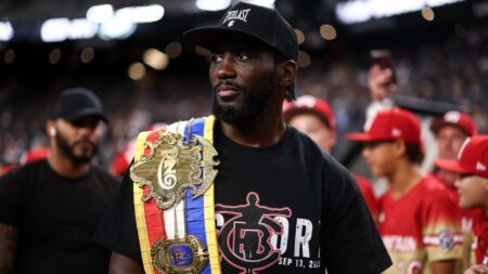 New undisputed champ Terence Crawford leads Nebraska on to the field ahead of key clash with Michigan