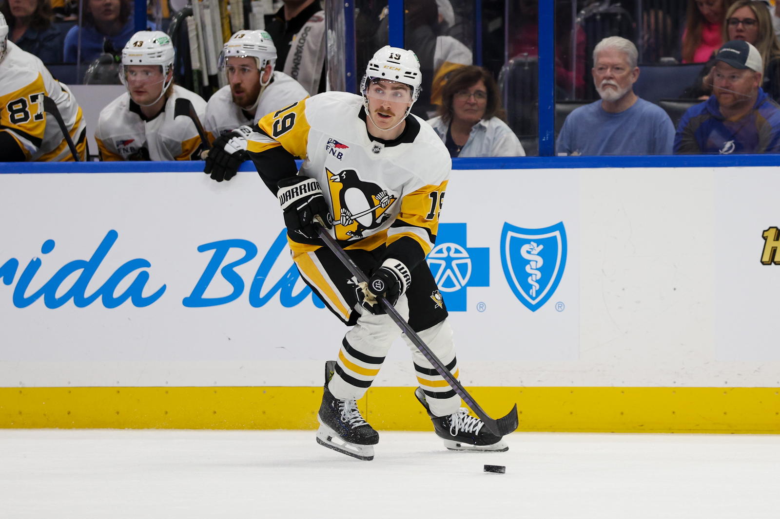 Mar 25, 2025; Tampa, Florida, USA; Pittsburgh Penguins center Connor Dewar (19) controls the puck against the Tampa Bay Lightning in the second period at Amalie Arena. Mandatory Credit: Nathan Ray Seebeck-Imagn Images