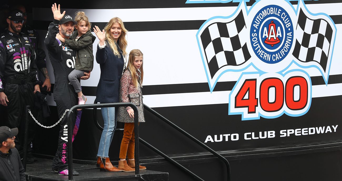 Jimmie Johnson, driver of the No. 48 Ally Chevrolet, is introduced with his family ahead of the NASCAR Cup Series Auto Club 400 at Auto Club Speedway on March 1, 2020 in Fontana, California.