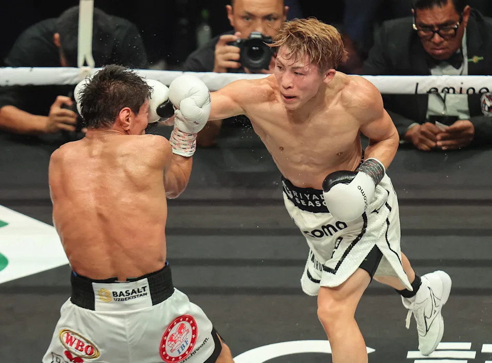 Japan's Naoya Inoue (R) fights against Uzbekistan's Murodjon Akhmadaliev (L) in the seventh round of their super bantamweight boxing title fight at the IG Arena in Nagoya, Aichi prefecture on September 14, 2025.  (Photo by JIJI Press / AFP) / Japan OUT (Photo by STR/JIJI Press/AFP via Getty Images)          
