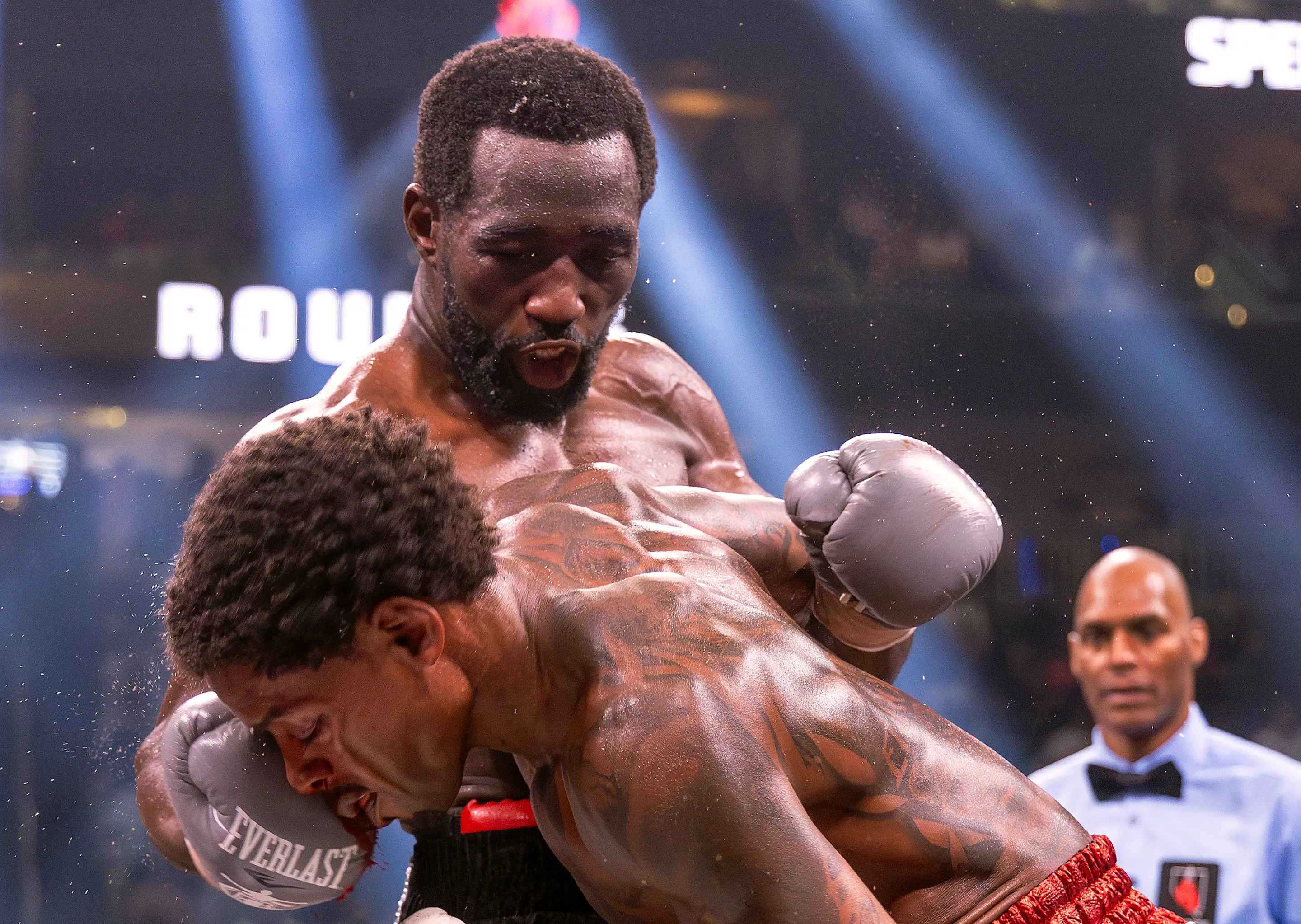 LAS VEGAS, NEVADA - JULY 29:  Terence Crawford punches Errol Spence Jr. during round 7 of their World Welterweight Championship bout at T-Mobile Arena on July 29, 2023 in Las Vegas, Nevada. (Photo by Al Bello/Getty Images)