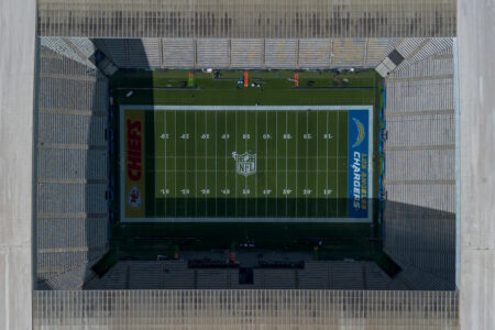 Why do the Kansas City Chiefs have their logo in an end zone as the away team vs. Los Angeles Chargers in Brazil?