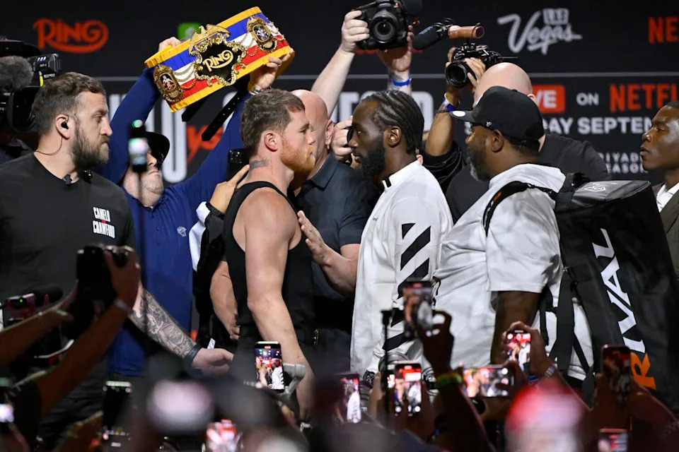 Canelo Álvarez and Terence Crawford face off onstage during news conference at T-Mobile Arena on Thursday in Las Vegas.