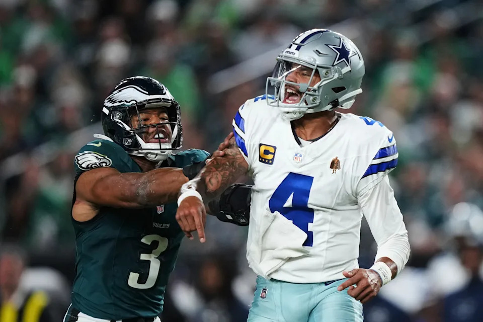 Dallas Cowboys quarterback Dak Prescott (4) releases a pass under pressure from Philadelphia Eagles linebacker Nolan Smith Jr. (3) in the second half of an NFL football game Thursday, Sept. 4, 2025, in Philadelphia. (AP Photo/Matt Slocum)