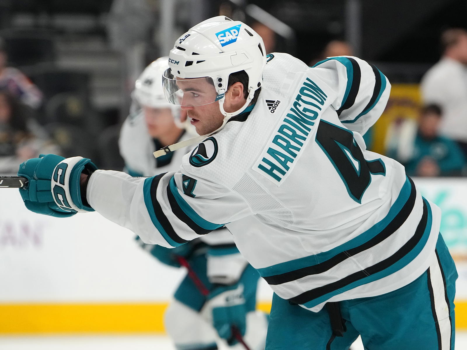 Feb 16, 2023; Las Vegas, Nevada, USA; San Jose Sharks defenseman Scott Harrington (4) warms up before a game against the Vegas Golden Knights at T-Mobile Arena. <i>Mandatory Credit: Stephen R. Sylvanie-Imagn Images</i>