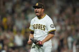 Padres clinch playoff spot with extra-innings victory over Brewers