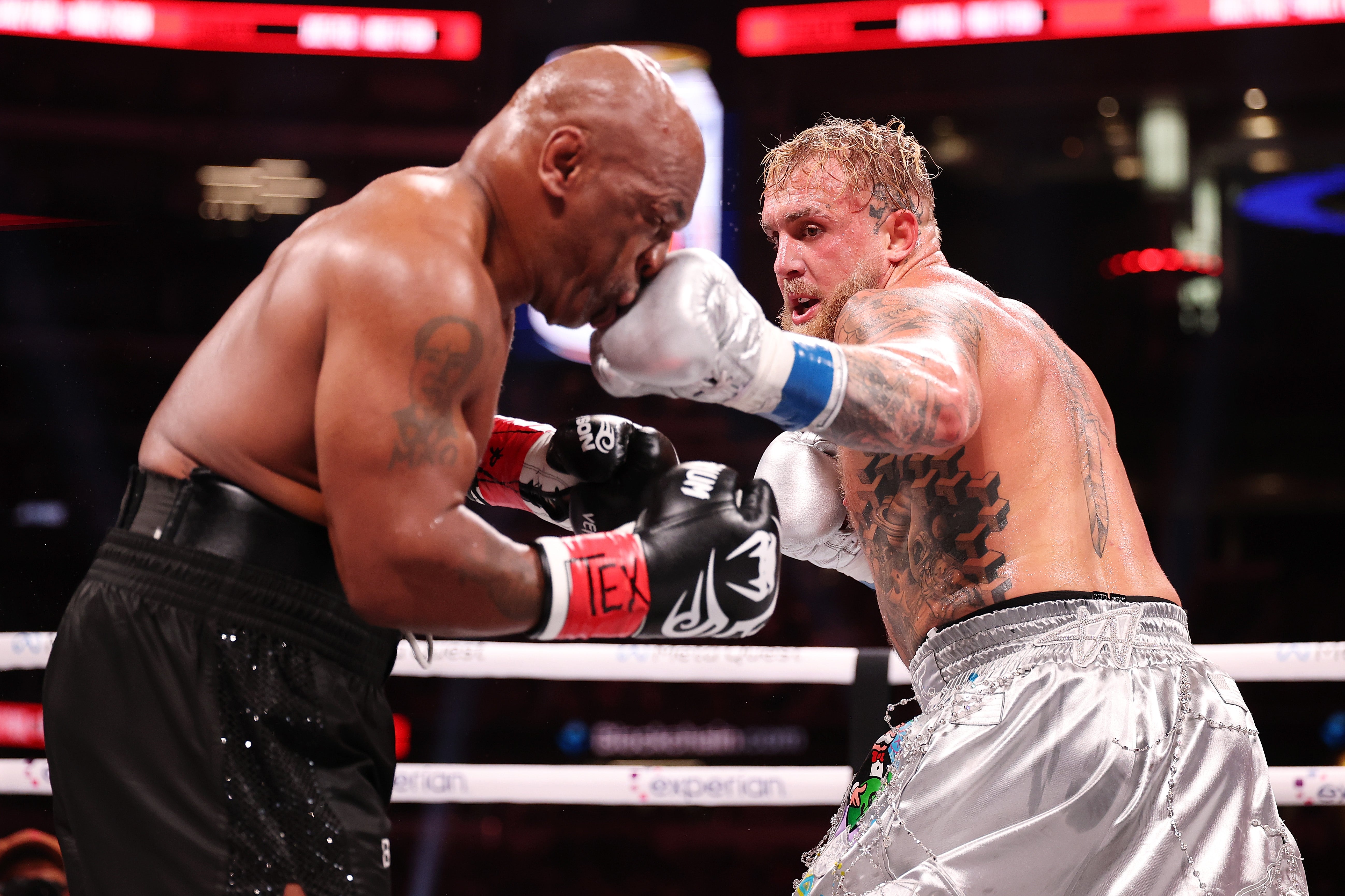 Mike Tyson (left) during his last fight, a points loss to YouTuber Jake Paul in November
