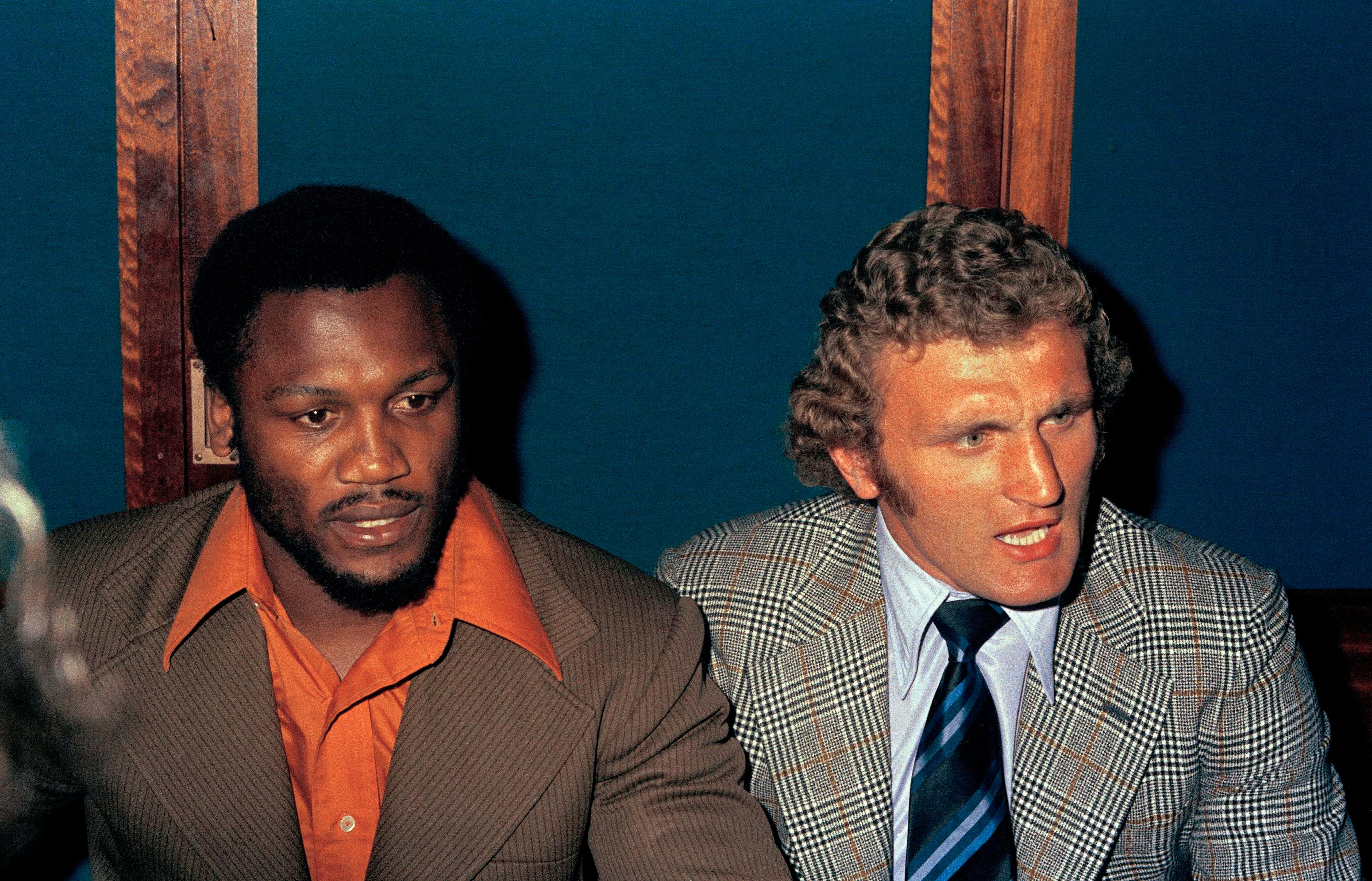 Bugner alongside Joe Frazier in 1973