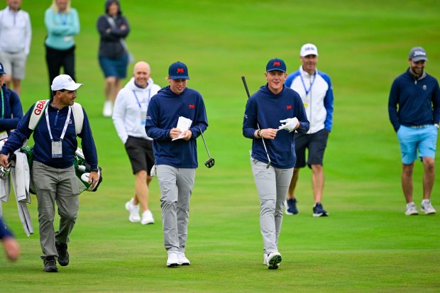Florida golfer Luke Poulter, right and playing for the GB&I side, walks with England's Charlie Forster down the first hole fairway during a practice round of the 2025 Walker Cup Sept. 4, 2025, at Cypress Point Club in Pebble Beach, Calif. (Logan Whitton/USGA)
