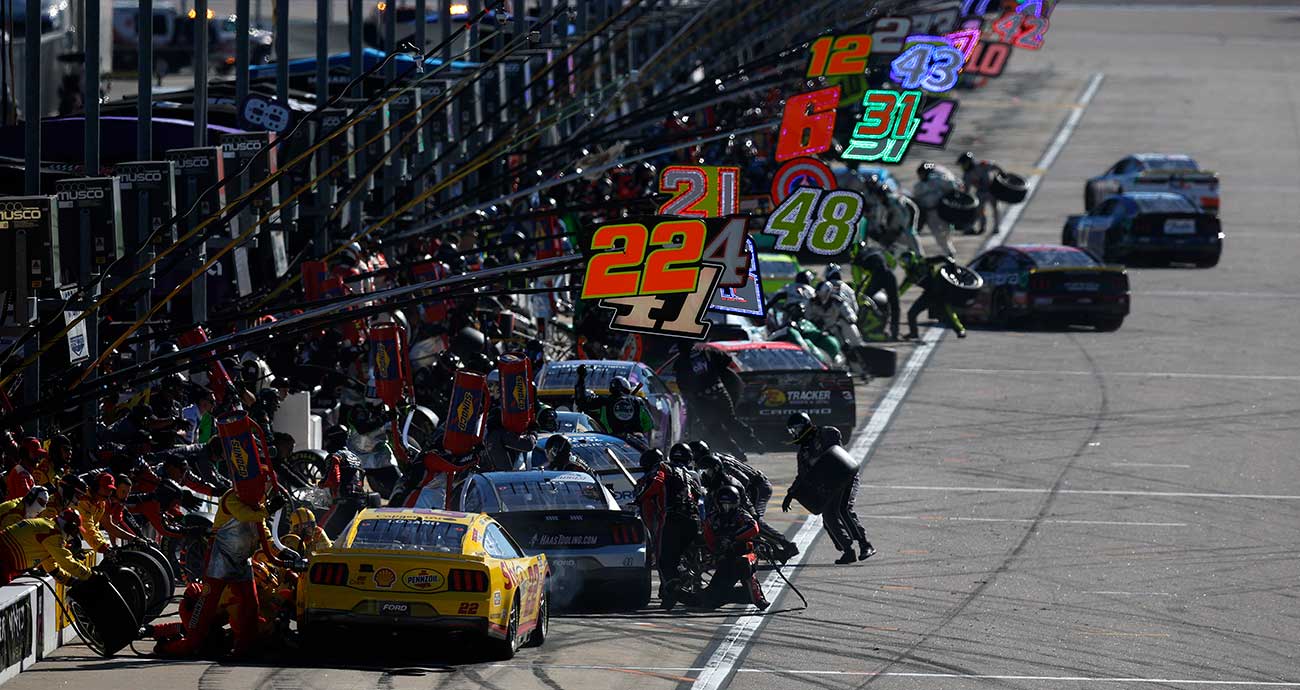 Pit road at Kansas Speedway is a busy place as the Cup Series field stops for service
