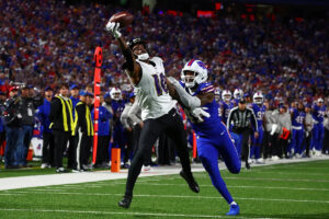 Ravens QB Lamar Jackson shoves Bills fan who struck him and DeAndre Hopkins on the helmet after a TD in loss