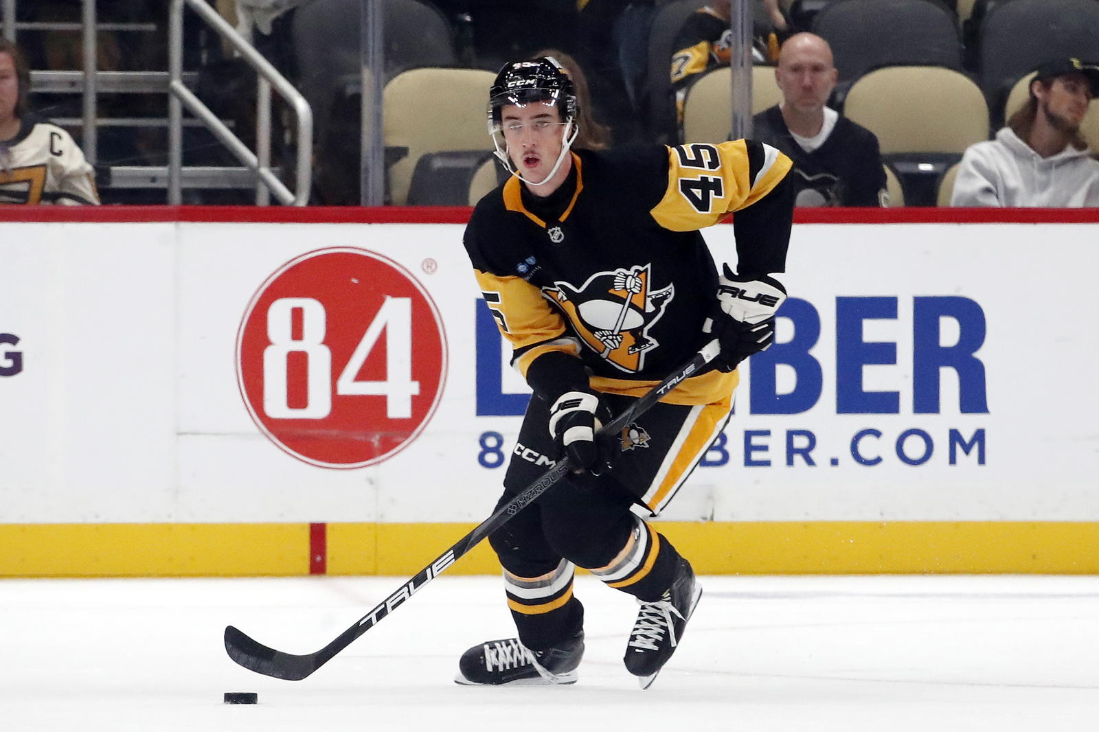 Oct 4, 2024; Pittsburgh, Pennsylvania, USA; Pittsburgh Penguins defenseman Harrison Brunicke (45) skates with the puck against the Columbus Blue Jackets during the third period at PPG Paints Arena. Mandatory Credit: Charles LeClaire-Imagn Images