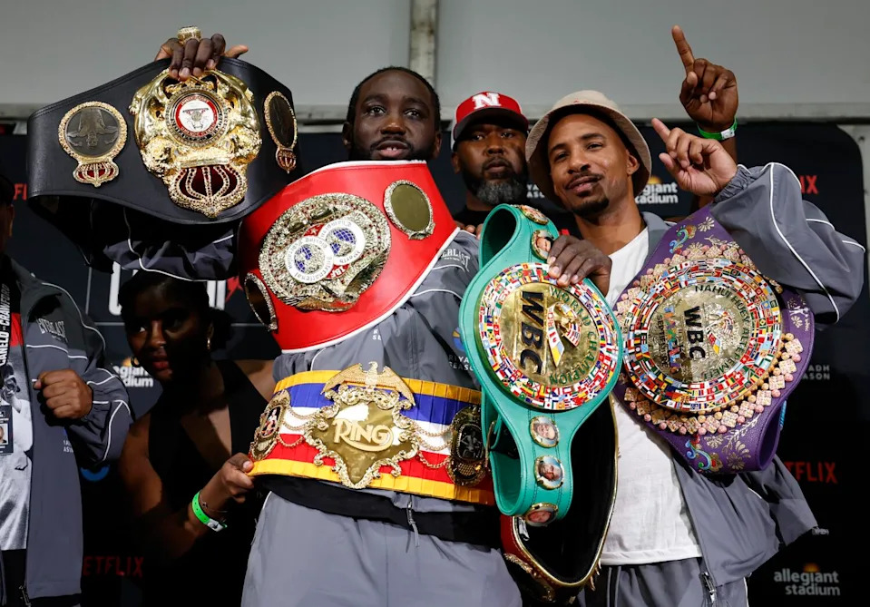 Terence Crawford displays his title belts after defeating Canelo Álvarez (not pictured).