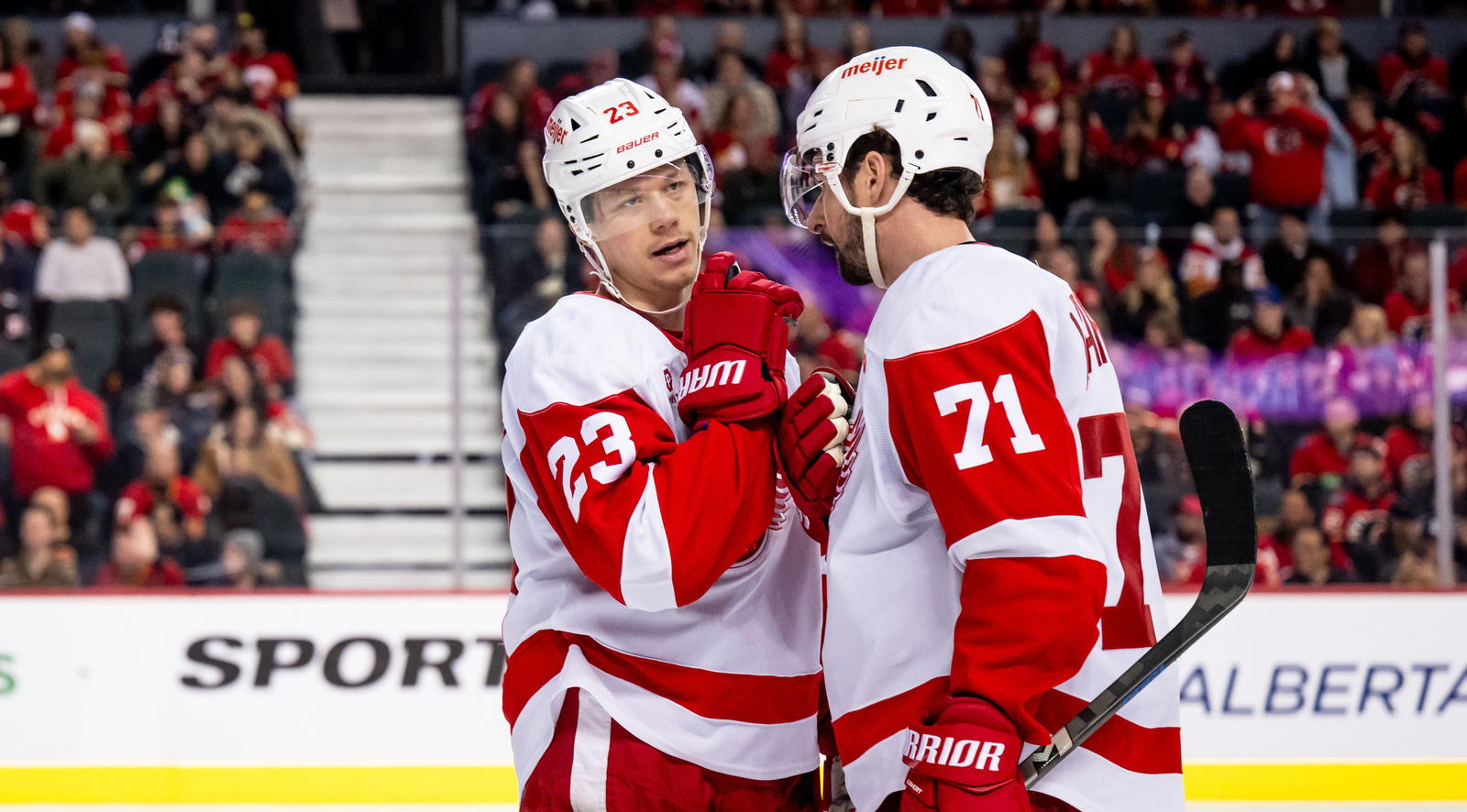 Lucas Raymond and Dylan Larkin (Brett Holmes-Imagn Images)