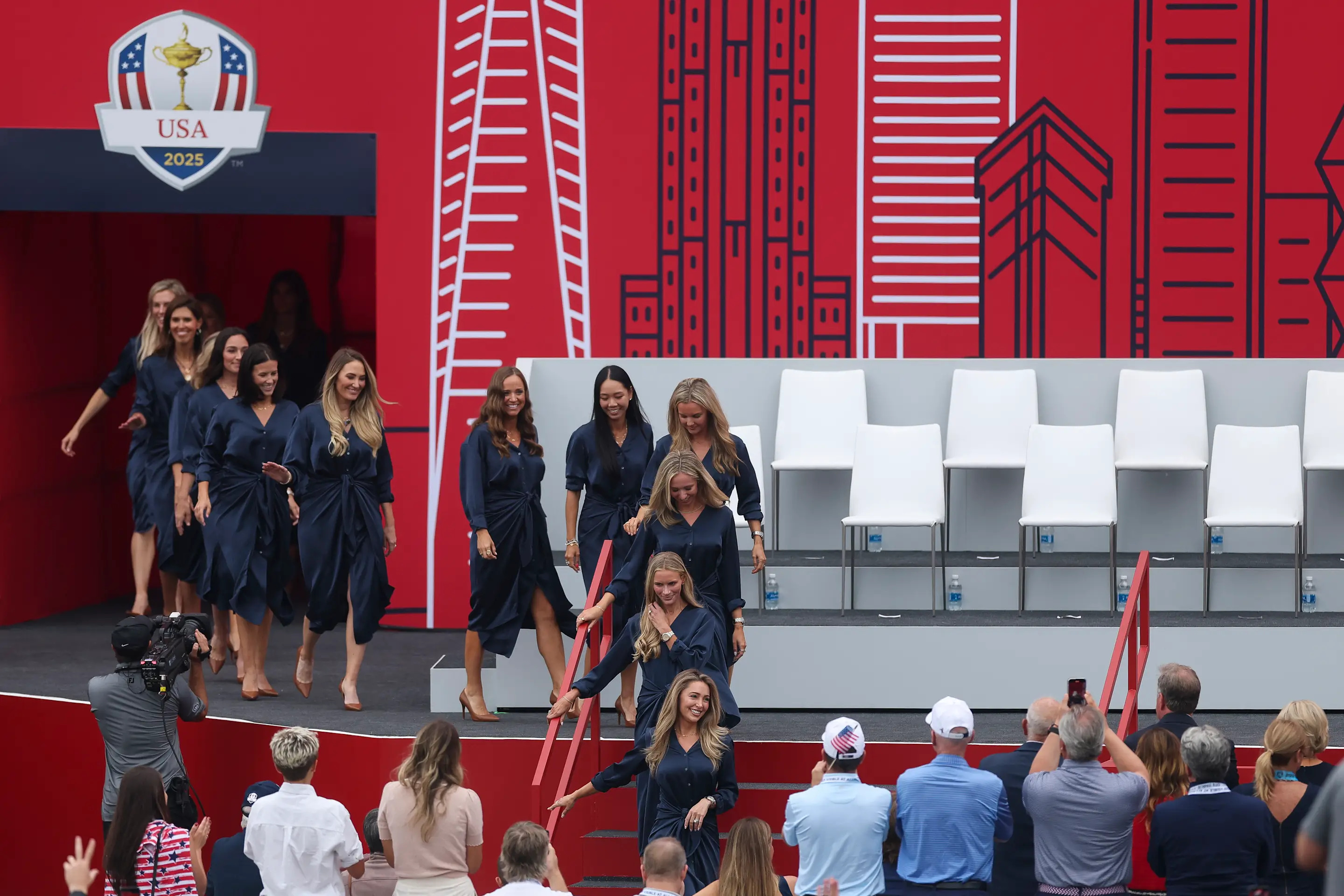 FARMINGDALE, NEW YORK - SEPTEMBER 24: Wives and Partners of Team United States walk on stage during the opening ceremony for the 2025 Ryder Cup at Black Course at Bethpage State Park Golf Course on September 24, 2025 in Farmingdale, New York. (Photo by Carl Recine/Getty Images)