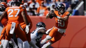Broncos lead Titans 10-9 at halftime as game enters lightning delay