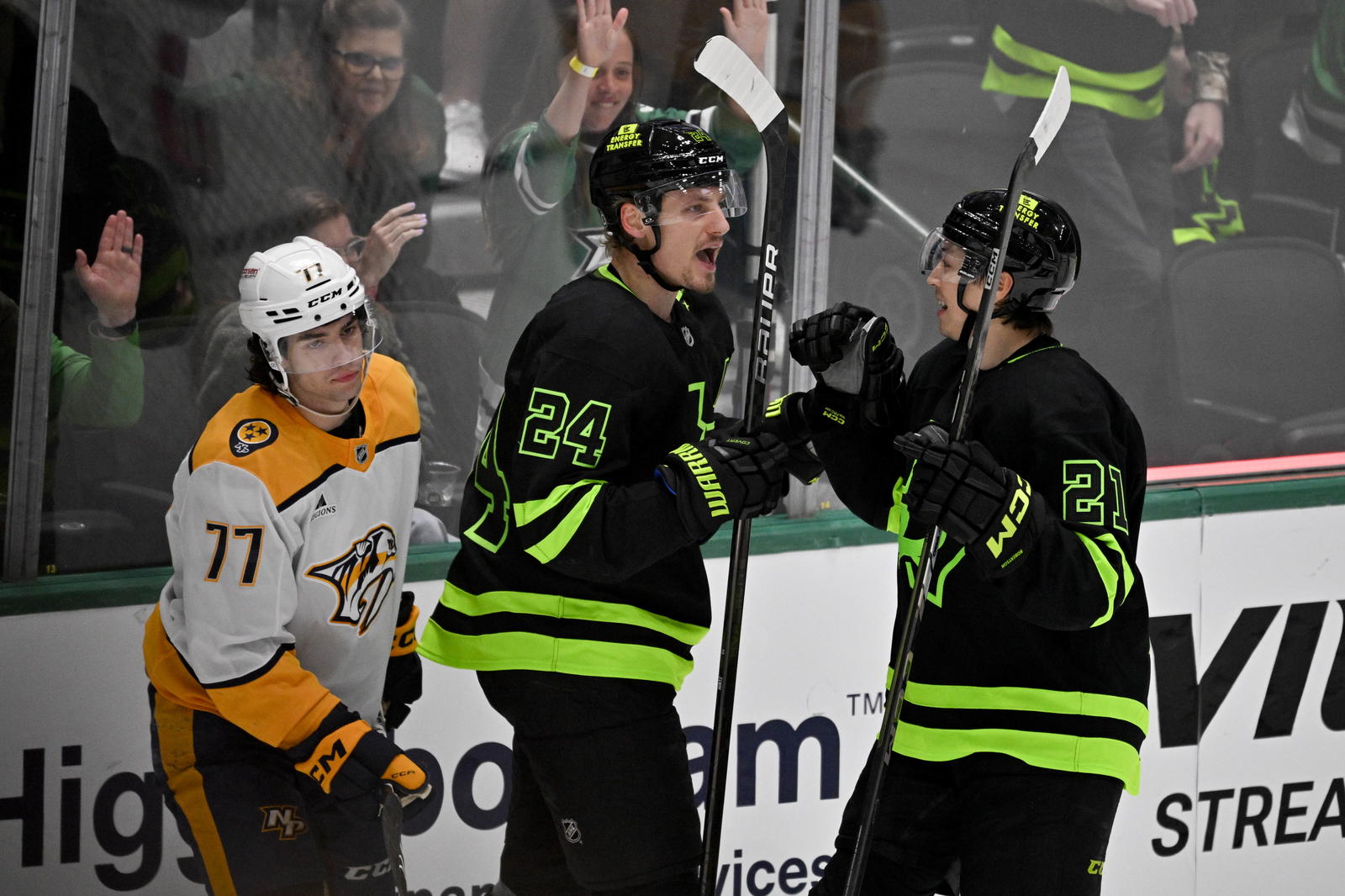 Apr 3, 2025; Dallas, Texas, USA; Dallas Stars center Roope Hintz (24) and left wing Jason Robertson (21) celebrates a goal scored by Hintz against the Nashville Predators during the third period at the American Airlines Center. Mandatory Credit: Jerome Miron-Imagn Images