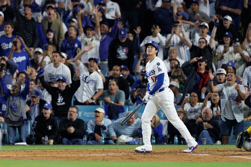 Fans cheer as Dodgers pitcher Shohei Ohtani hits his third home run during Game 4 of the NLCS.
