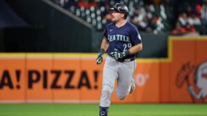 Cal Raleigh Meets Mariners Fan Who Caught HR with Viral ‘Dump 61 Here’ Shirt in Photo