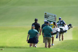 Vince Whaley has an audience with a set of teeth. He hits shot with alligator behind him