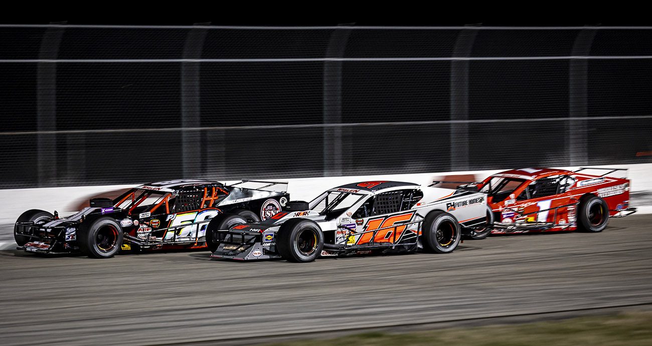 Tyler Catalano (56), Ron Silk (16), and Patrick Emerling (1) during the IceBreaker 150 for the Whelen Modified Tour at Thompson Speedway Motorsports Park on April 16, 2025 in Thompson, Connecticut. (Rob Branning/NASCAR)