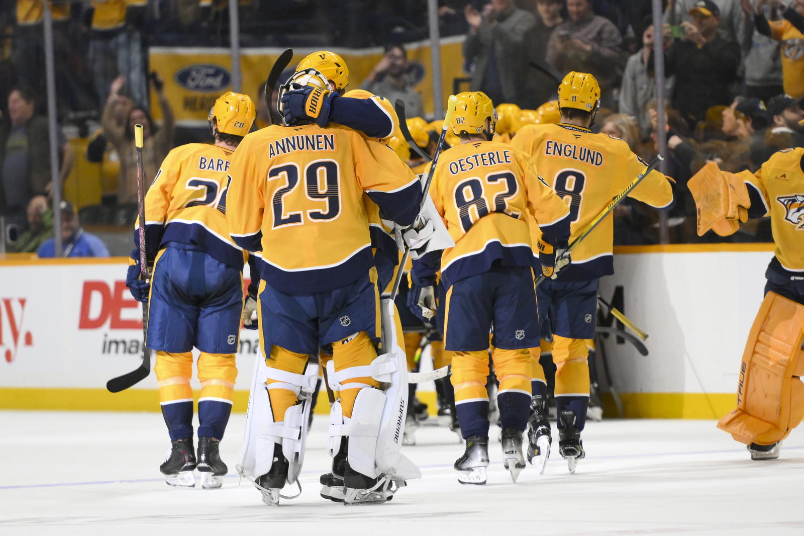 Apr 8, 2025; Nashville, Tennessee, USA; Nashville Predators center Fedor Svechkiv (40) celebrates his game=winning goal with his teammates during the over time period at Bridgestone Arena. Steve Roberts-Imagn Images