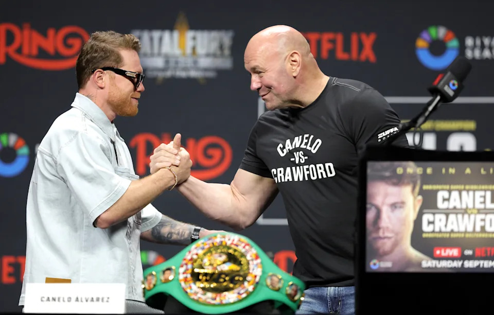 LAS VEGAS, NEVADA - JUNE 27: Undisputed super middleweight champion Canelo Alvarez (L) greets UFC president Dana White during a news conference at T-Mobile Arena on June 27, 2025 in Las Vegas, Nevada. Alvarez is scheduled to defend his titles against undefeated boxer Terence Crawford on September 13, 2025, at Allegiant Stadium in Las Vegas. White is part of a team promoting the event. (Photo by Steve Marcus/Getty Images)