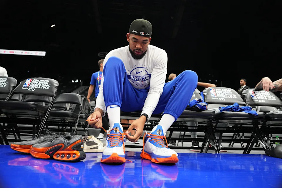 ABU DHABI, UAE - OCTOBER 1: Karl-Anthony Towns #32 of the New York Knicks laces up during practice and media availability as part of 2025 NBA Global Games Abu Dhabi at Etihad Arena on October 1, 2025 in Abu Dhabi, The United Arab Emirates. NOTE TO USER: User expressly acknowledges and agrees that, by downloading and/or using this Photograph, user is consenting to the terms and conditions of the Getty Images License Agreement. Mandatory Copyright Notice: Copyright 2025 NBAE (Photo by Jesse D. Garrabrant/NBAE via Getty Images)