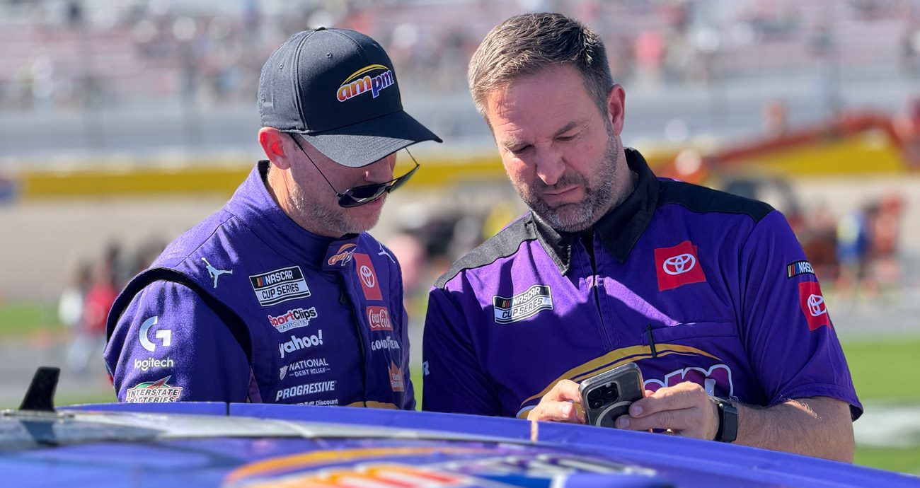 Denny Hamlin and Chris Gayle speak before racing at Las Vegas.