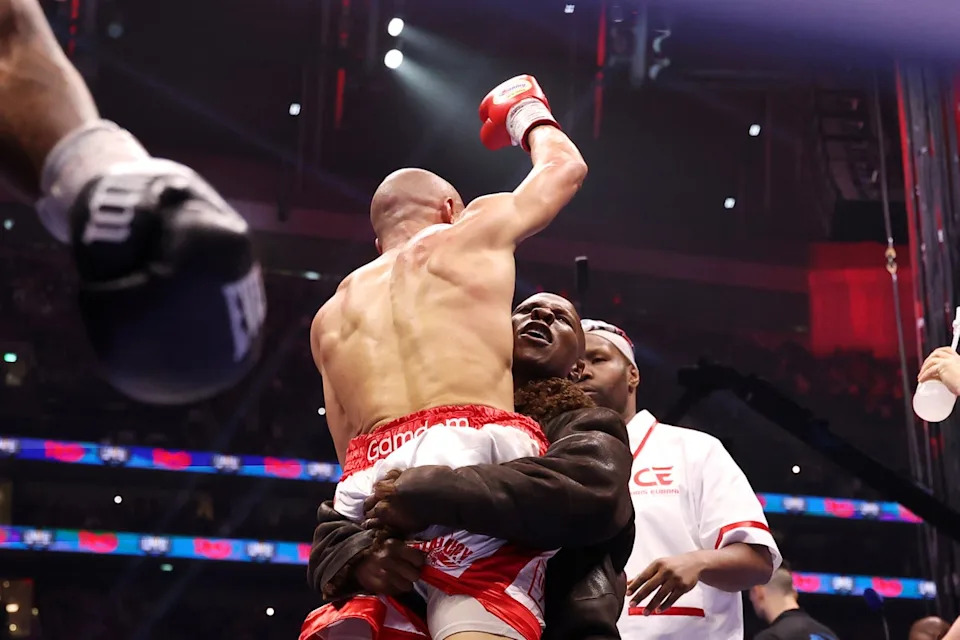 Chris Eubank Sr hoists his son aloft after Jr beat Conor Benn last April (Getty Images)