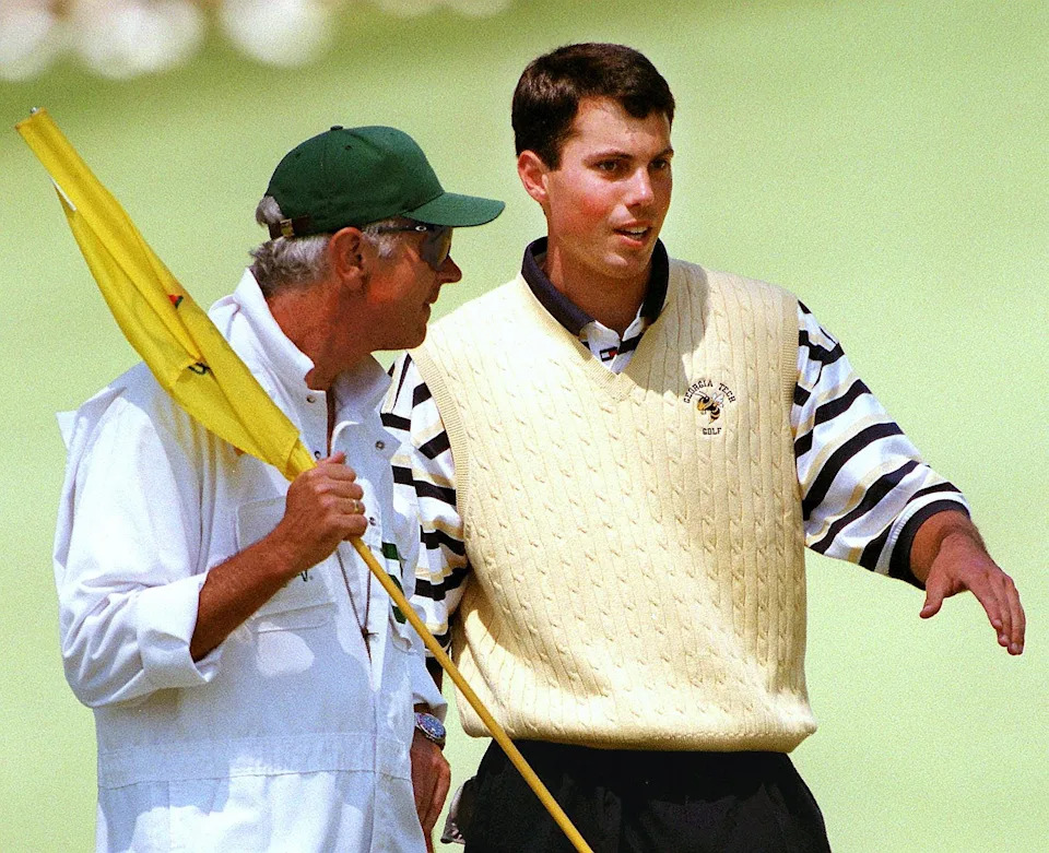 Matt Kuchar and his father Peter discuss a putt on the 10th green during third round of the 1998 Masters at Augusta National Golf Club.