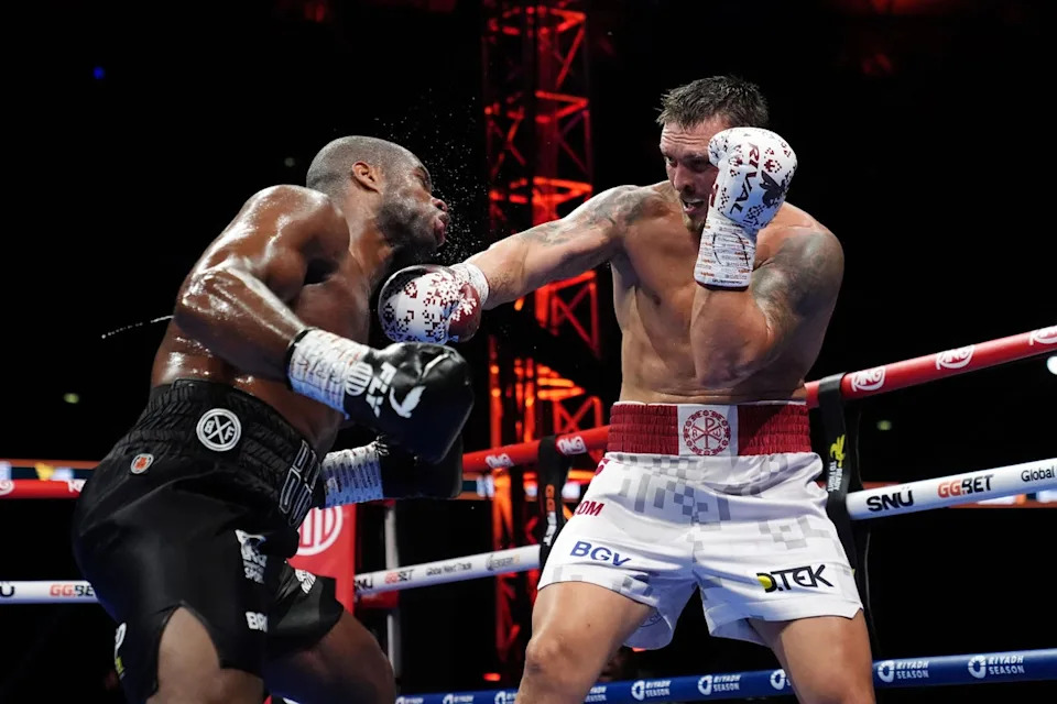 Oleksandr Usyk (right) during his second victory over Daniel Dubois, last July (PA Wire)