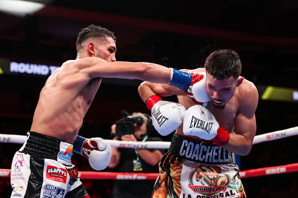 PALM SPRINGS, CALIFORNIA - JANUARY 16: Jorge 'El Nino Dorado' Chavez lands a punch on Manuel 'Gucci Manny' Flores during their fight at Acrisure Arena on January 16, 2026 in Palm Springs, California. (Photo by Cris Esqueda/Golden Boy/Getty Images)