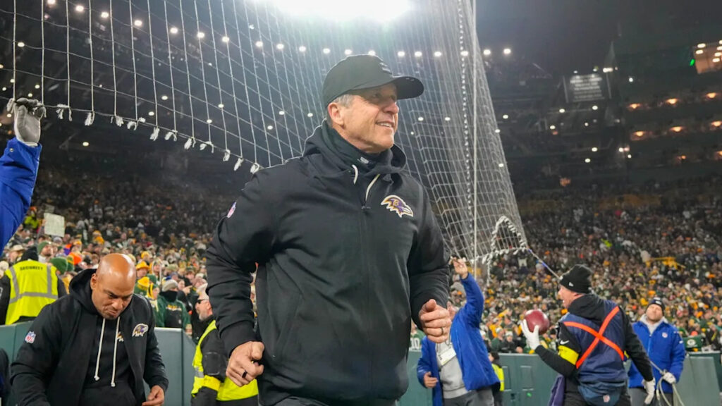 Which team with a coach currently in place called about John Harbaugh?