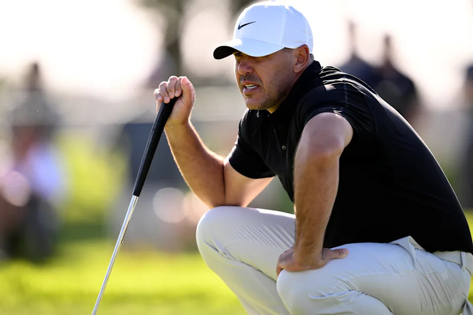 Brooks Koepka lines up a putt on the first hole during the first round of the 2026 Farmers Insurance Open at Torrey Pines South Course.