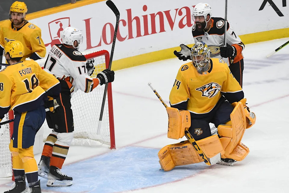Nov 14, 2023; Nashville, Tennessee, USA; Anaheim Ducks defenseman Radko Gudas (7) and left wing Alex Killorn (17) celebrate after a goal against Nashville Predators goaltender Juuse Saros (74) during the third period at Bridgestone Arena. Mandatory Credit: Christopher Hanewinckel-Imagn Images